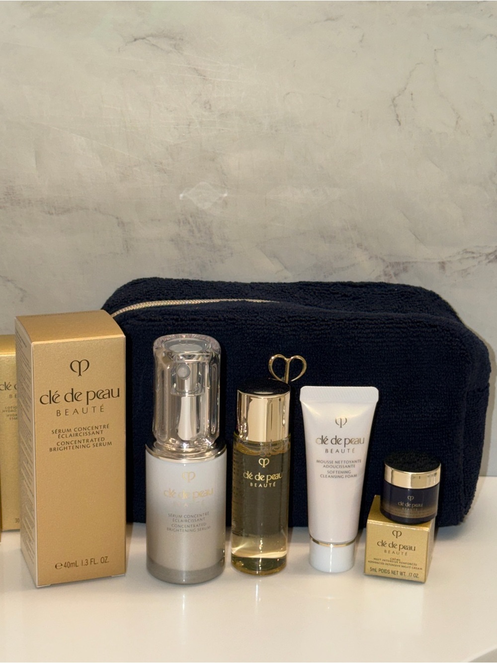 Cle de Peau CONCENTRATED BRIGHTENING SERUM plus travel size products and bag - Picture 5 of 12